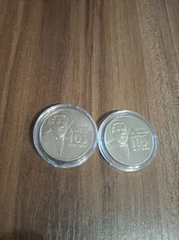 Продам памятную монету Джон Джеймс ЮЗ (нейзильбер), 2014 г. Тираж-20000