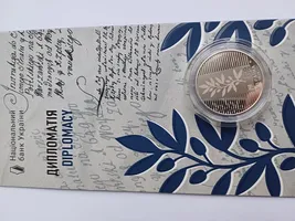 Продам пам'ятну монету "Дипломатія" у сувенірному пакованні (нейзильбер)